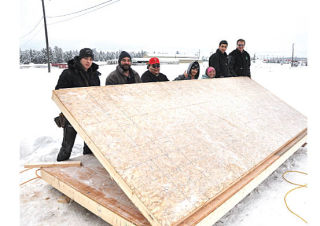 Students and instructors get a little help from Invermere College of the Rockies manager Doug Clovechok to start putting walls to a shed for the Columbia Valley Chamber of Commerce in Invermere. Pictured left to right are Joe Simmons