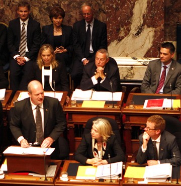 Finance Minister Mike de Jong presents the government's post-election budget to the legislature in July.