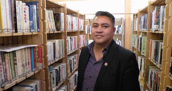 Terry Teegee of the Carrier Sekani Tribal Council tours a library rebuilt after the 2011 Japan tsunami