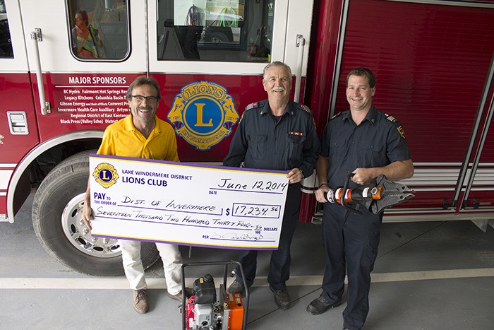 Lake Windermere District Lions Club member Harold Hazelaar (left) presents a cheque for $17