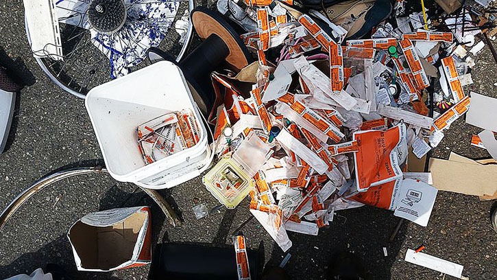 About 60 used needles and many more empty packages and protective caps were found dumped behind a commercial building in Maple Ridge