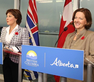 B.C. Premier Christy Clark and Alberta Premier Alison Redford announce framework agreement on oil pipeline development in Vancouver Tuesday.