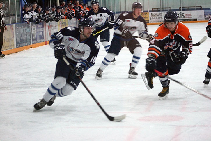 Rockies defenceman Davin Burton intently eyes the puck while chasing a Thunder Cat player in the Rockies games against Creston at the Eddie on January 9th. The Rockies lost 6-5.