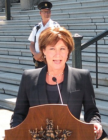 Legislature security guards watch as Premier Christy Clark comments on arrests in apparent terrorist bomb plot targeting Canada Day ceremonies at the B.C. legislature.