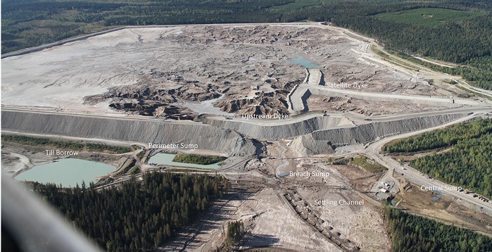 Aerial photo shows upstream dike and sumps to contain tailings at Mount Polley mine
