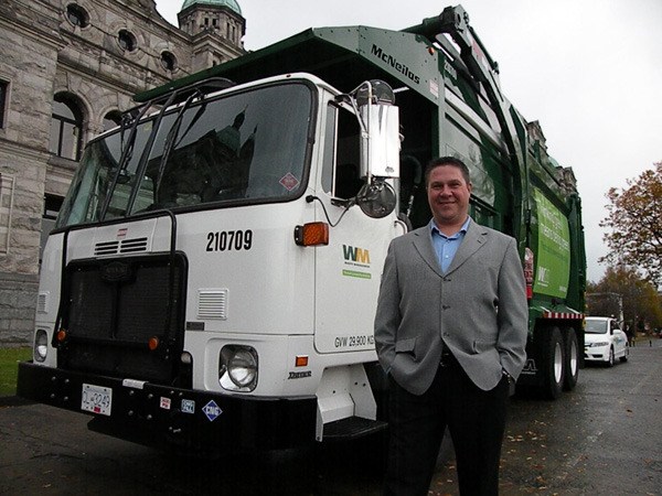 Waste Management's Scott Sadler with one of the company's 20 natural gas-powered trucks.
