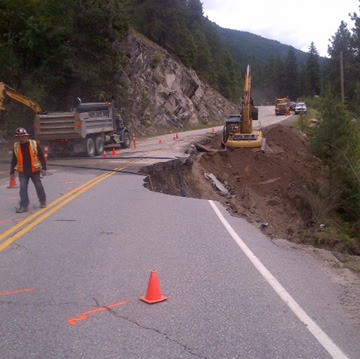 Repair work on severe washout of Highway 3A near Creston.