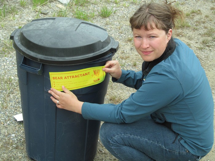 Bear Aware co-ordinator Crystal Leonard regularily goes out and applies bear attractants stickers to garbage cans left on the curb overnight.