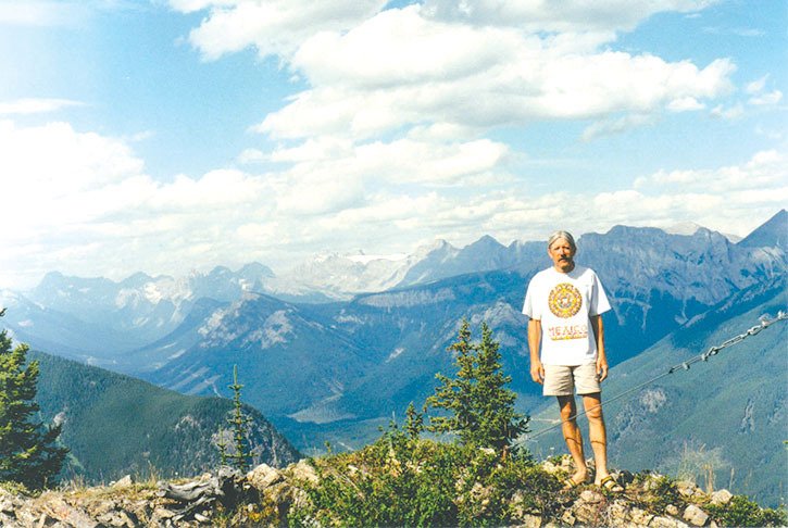 Will Wardwell stands at a lookout point in the photo that graces the cover of his new album