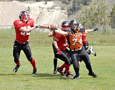 A Columbia Valley Bighorns player keeps his cool during the game against the Calgary Stamps midget football team.