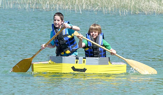 Two boys paddle their hardest at the duct-tape boat races on June 5 during Canal Flats Days.
