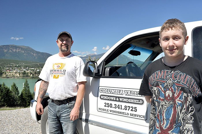 Columbia Valley Windows and Windshield Marc Robinson is getting help from his 13-year-old son Dawson this summer.