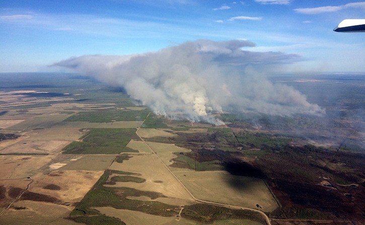 The Siphon Creek wildfire north of Fort St. John has spread east across the Alberta border.