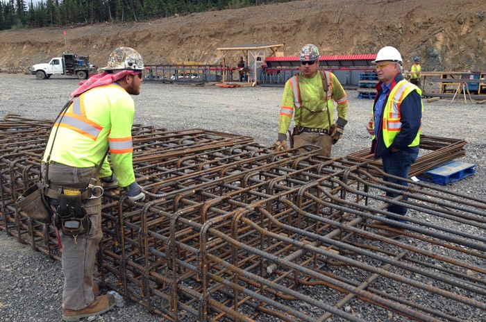 Energy and Mines Minister Bill Bennett (right) visits ironworkers at Red Chris Mine in northwestern B.C. The northwest transmission line is to be completed this year
