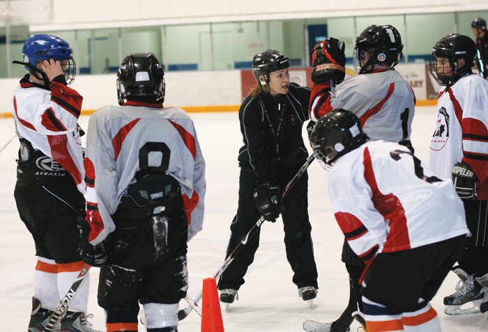 Daphne Neal leads Grade 6 and 7 students from J.A. Laird in a drill as part of the school's Hockey Academy.