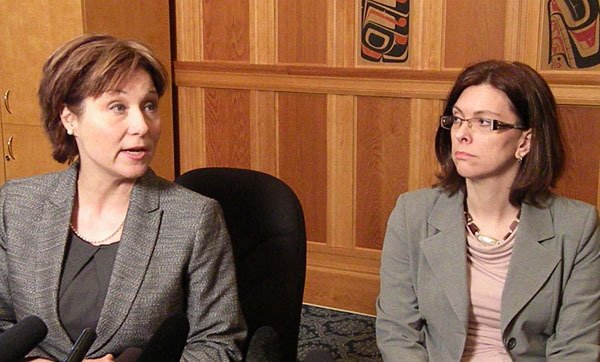 Premier Christy Clark and Labour Minister Stephanie Cadieux announce minimum wage increases at the B.C. legislature Wednesday.