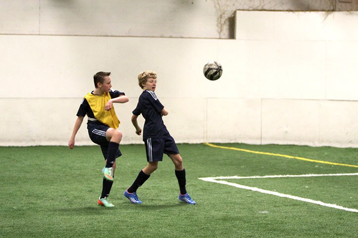 Invermere’s Emmett Mcdonald (in blue) and Hayden King of Castlegar were among the players from Nelson