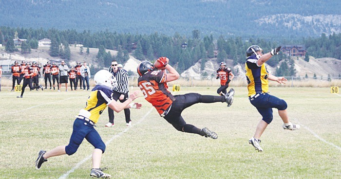 Dillon Falkmann of the Columbia Valley Bighorns makes a spectacular leaping catch during their game against the Vernon Magnums October 2.