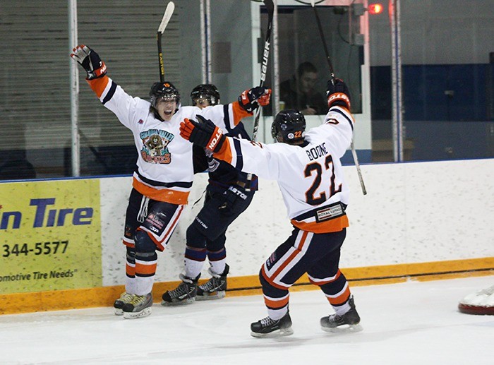 Rockies players Dustin Boone (#20) and Jerome Thorne celebrate after Thorne's second period tally in a 5-3 win over the Creston Valley Thunder Cats on Friday