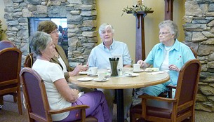 Guests enjoy some tea during Columbia Garden Village's tea time event.