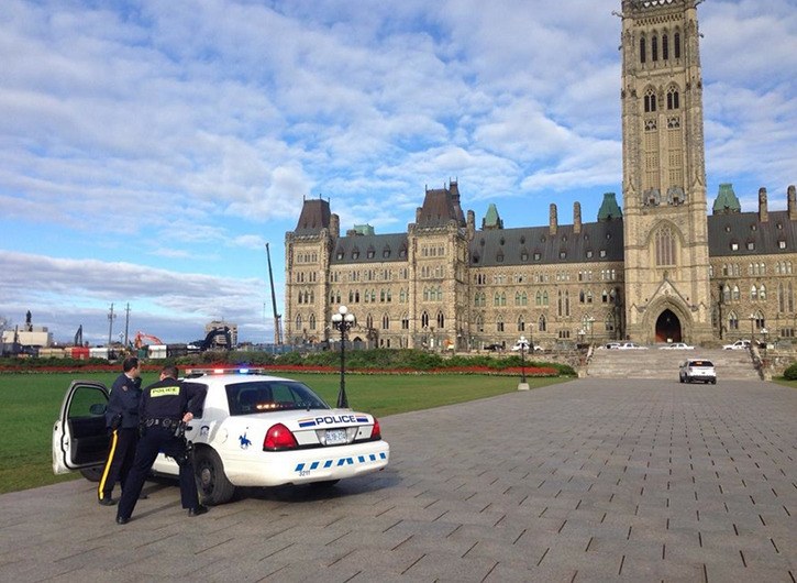 Parliamentary Journalist Richard Madan with CTV National News based in Ottawa sent out this picture on Twitter from Parliament Hill that police had their weapons drawn this morning after shots were fired.