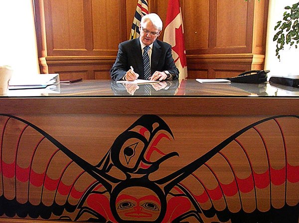 Premier Gordon Campbell in his legislature office Feb. 16. The red cedar leadership desk