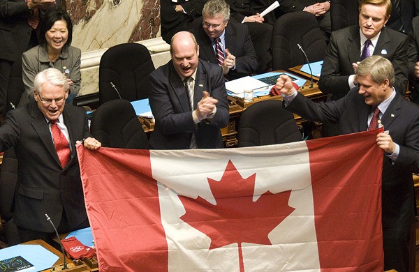 Premier Gordon Campbell and Prime Minister Stephen Harper celebrate the arrival of the 2010 Olympics at the B.C. legislature last February.