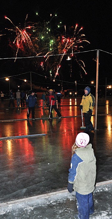 A young girl watches the fireworks during a pervious Snowflake Festival. This year