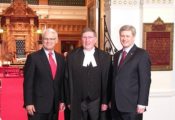 Former Premier Gordon Campbell and Speaker Bill Barisoff welcome Prime Minister Stephen Harper to the B.C. legislature before the 2010 Olympics.