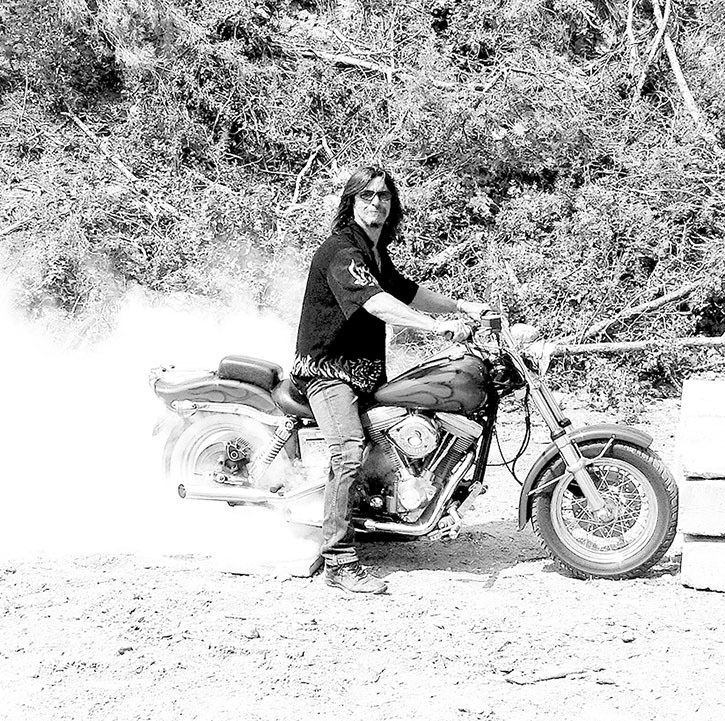 2009 — One of the over 600 motorcycle enthusiasts who attended the Horsethief Bike Rally performs a burnout during the weekend-long event.