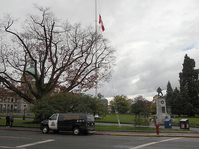Flag is lowered to half staff at B.C. legislature Wednesday after soldier confirmed killed in Ottawa shooting. Police van part of heightened security.
