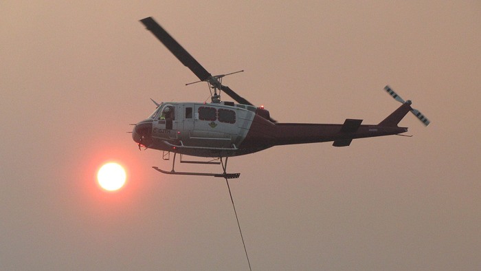 One of nine helicopters working to contain the Cheslaslie River fire west of Quesnel