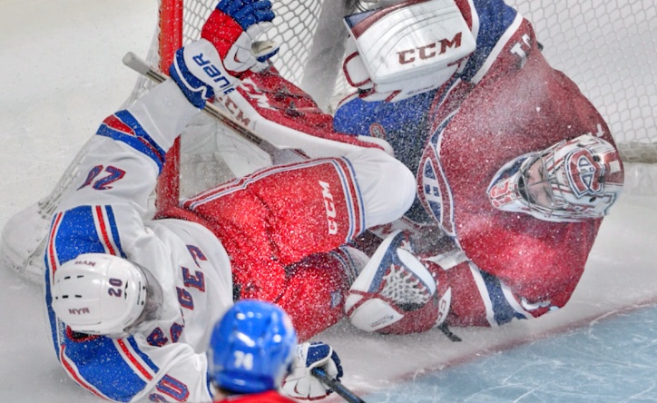 New York Rangers forward Chris Kreider slams feet-first into Montreal Canadiens goalie Carey Price