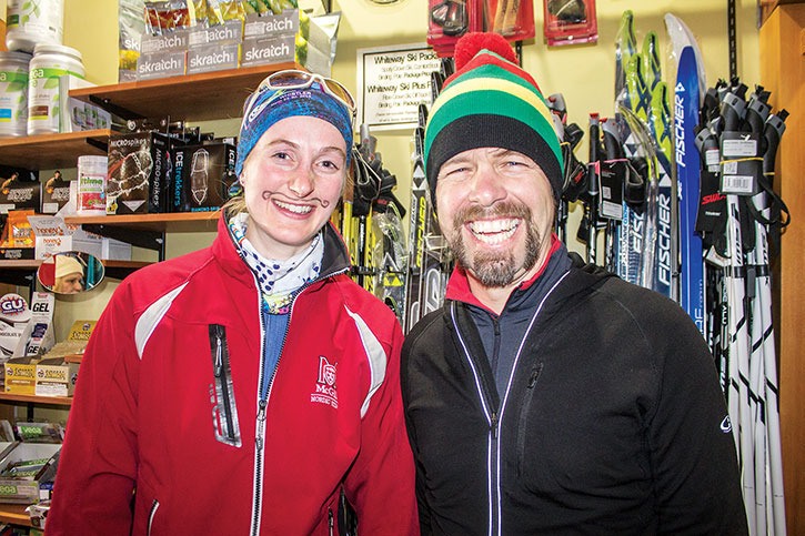 Jordie Kirk with Canfor Radium and Katrina Dutkiewcz warm up inside Crazy Soles before stripping down and running through the frigid streets of Invermere on Sunday