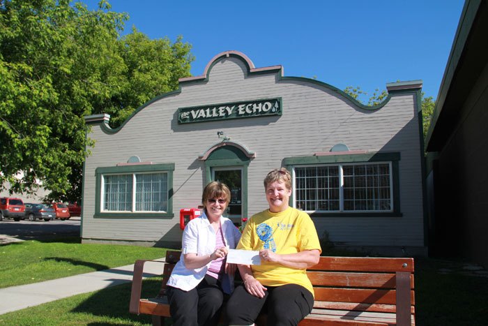 Valley Echo publisher Marilyn Berry hands over a cheque for $651 to Canadian Cancer Society Relay for Life organizer Sheila Tutty.