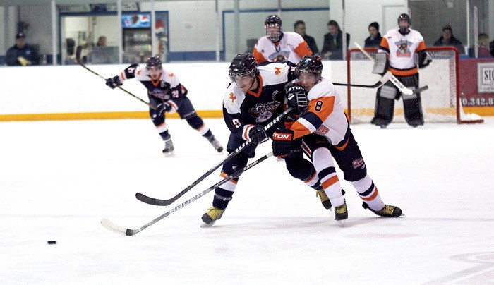 Columbia Valley Rockies defender Chel Andersen attempts to make a play on the puck during home ice action Saturday