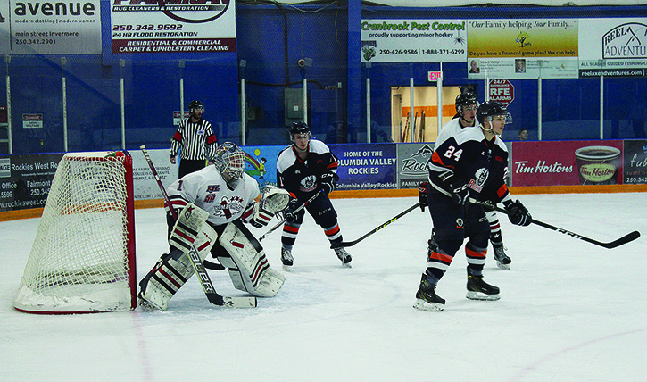 Rockies players crowd the Kimberley Dynamiters' net at the Eddie on Saturday night.