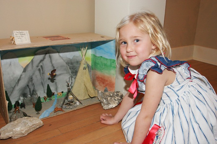 May 2008 — Four year-old Katia Fanderl was enthralled with the 3-D exhibit at the Wings Over the Rockies art show at the Pynelogs Cultural Centre.