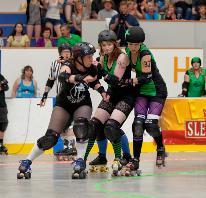 Killer Rollbot Fräulein Chaotic gets ready to block a couple of Mountain Town Maulers along the inside line at the Cranbrook bout on May 12.