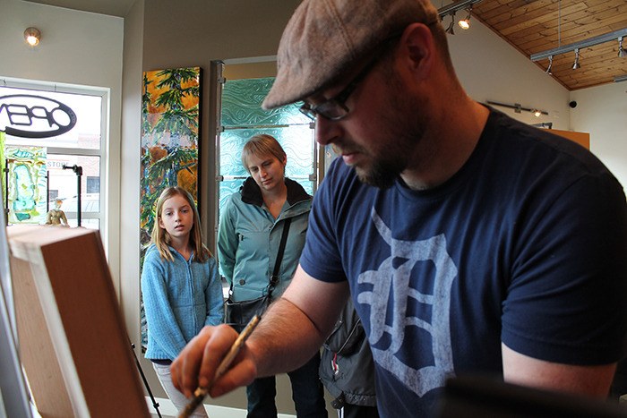 Artist David Zimmerman captivates onlookers during his demonstration at Effusion Art Gallery on Febraury 16.