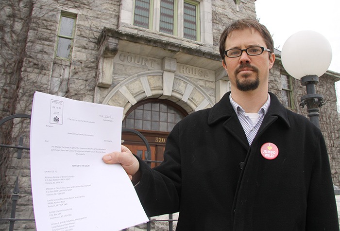 West Kootenay EcoSociety executive director David Reid stands outside the Nelson courthouse Monday (February 18) afternoon after submitting an application for a judicial review of the Jumbo Glacier Mountain Resort Municipality.