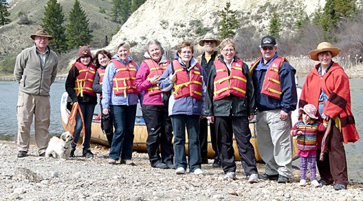 A group prepares to set course for a canoe ride.
