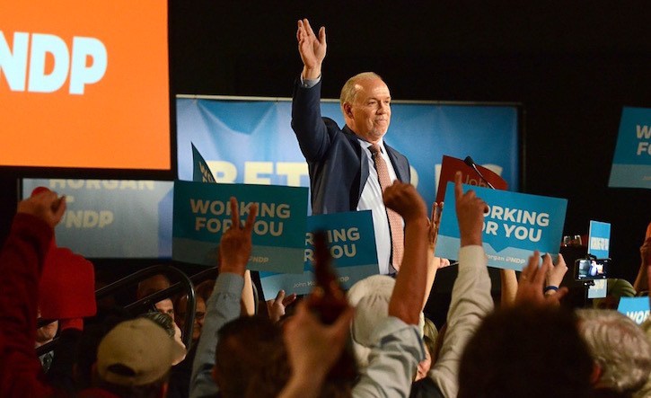 Supporters raise hands