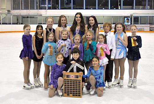 The Columbia Valley Figure Skating Club posing with their 'Most Sportsmanship Club' award.