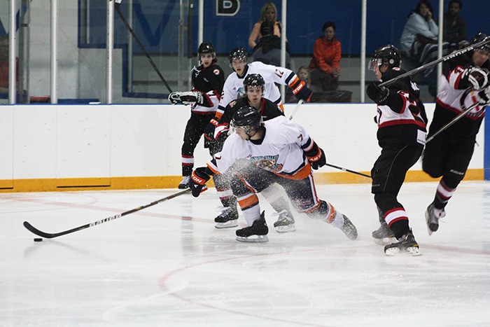 Rookie Liam Neary reaches for the puck during the Rockies 4-3 overtime loss to the Kimberley Dynamiters on Tuesday September 18.