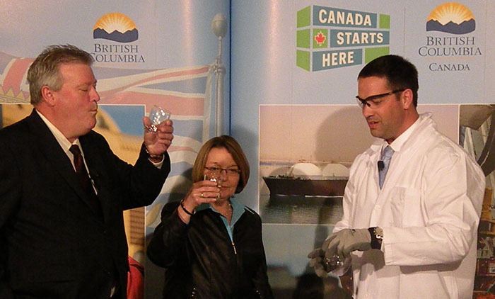 Natural Gas Development Minister Rich Coleman and Jobs and Tourism Minister Shirley Bond drink water after LNG has been poured into it and allowed to vapourize
