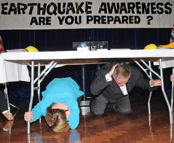 Public Safety Minister Shirley Bond and Speaker Bill Barisoff take part in earthquake drill at the B.C. legislature Thursday.