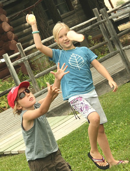 Children play with water balloons at the Windermere Valley Museum.