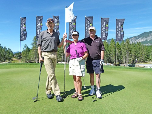 Golfers taking part in the Health Care Golf Tournament stand proud at Hole #1 at The Ridge Golf Course at Copper Point.
