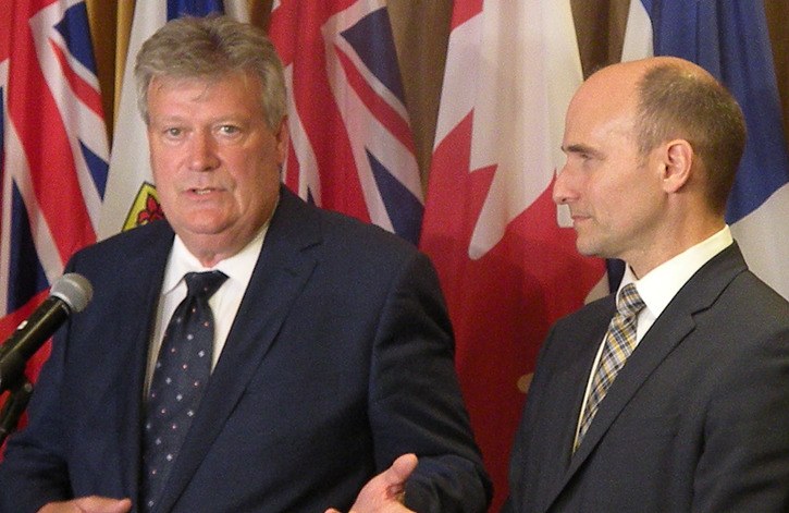 B.C. Housing Minister Rich Coleman and his federal counterpart Jean-Yves Duclos speak to reporters in Victoria Tuesday after two days of meetings to plan a national housing strategy.